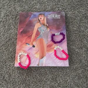 Taylor Swift Tour Book with Pink and Purple Bracelets